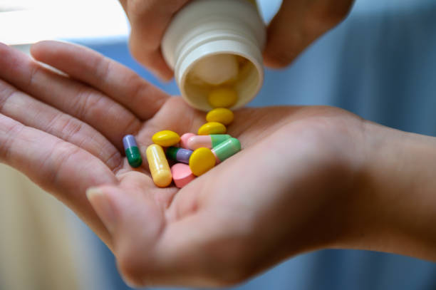 istock Medicine bottle and colorful pills 1219393885