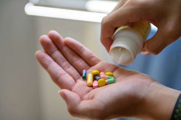 istock Medicine bottle and colorful pills 1219393897