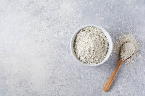 istock Closed collagen in a ceramic bowl on an old gray concrete background. Flat lay with copy space. 1219393909