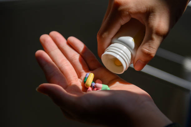 istock Medicine bottle and colorful pills 1219393953