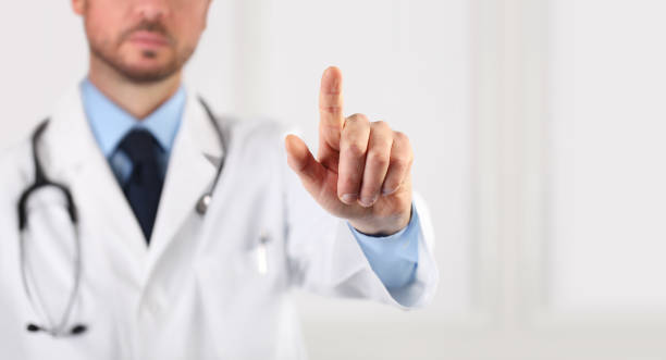 istock isolated doctor hand touch screen pointing with your finger on white copy space background 1219396020