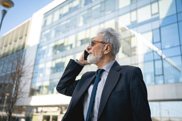 istock Senior businessman arranges work on the move 1219397044