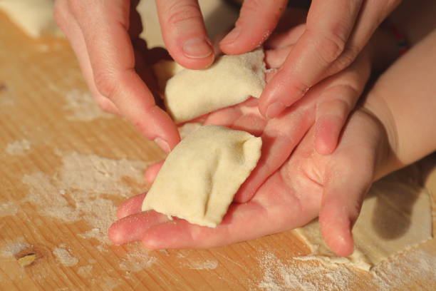 istock Traditional ravioli preparation - Italian handmade pasta 1219397185
