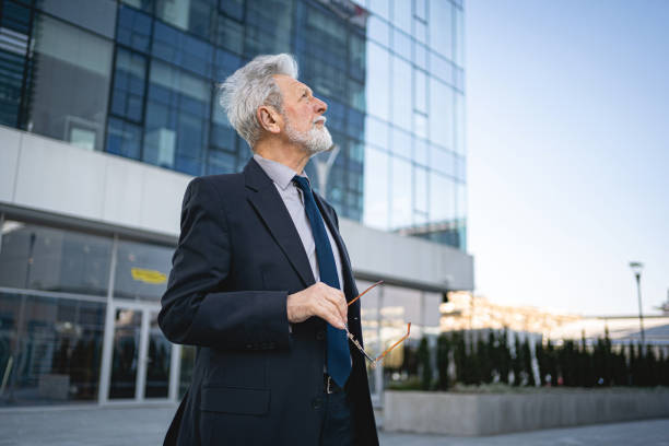 istock Senior investor evaluating his investment 1219397408