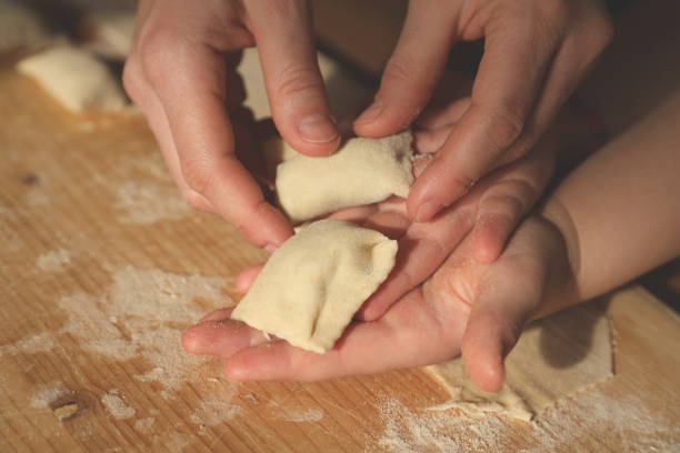 istock Traditional ravioli preparation - Italian handmade pasta 1219397540