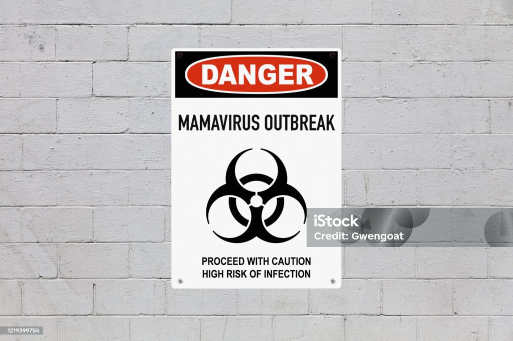 Danger - Mamavirus outbreak Warning sign screwed to a brick wall to warn about a health hazard. In the middle of the panel, there is a biohazard symbol and the message is saying "Danger, Mamavirus outbreak. Proceed with caution, high risk of infection". Biohazard Symbol Stock Photo