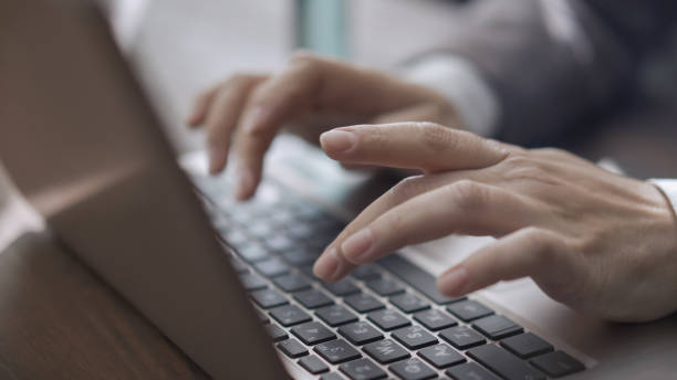 istock Female Hands Typing On Laptop Keyboard 1219401206