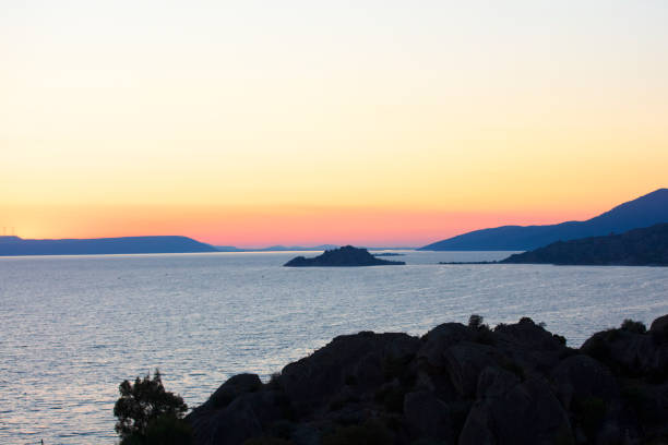 istock Landscape image of sunset at SEA 1219403221