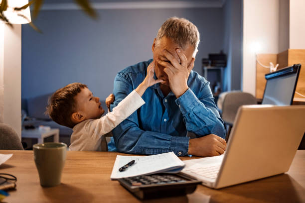 istock Father trying to work from home 1219404003