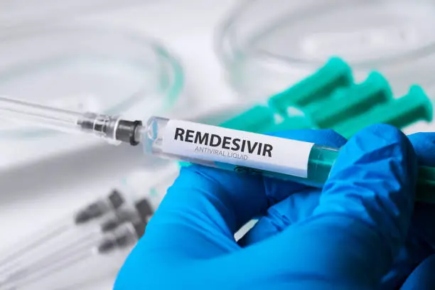 Photo of remdesivir covid-19 liquid medication background