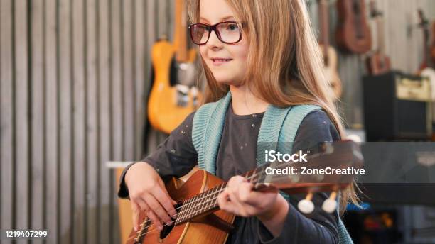 Dad Teaching Guitar And Ukulele To His Daughterlittle Girl Learning Guitar At Homeclose Upukulele Class At Home Child Learning Guitar From Her Father Stock Photo - Download Image Now