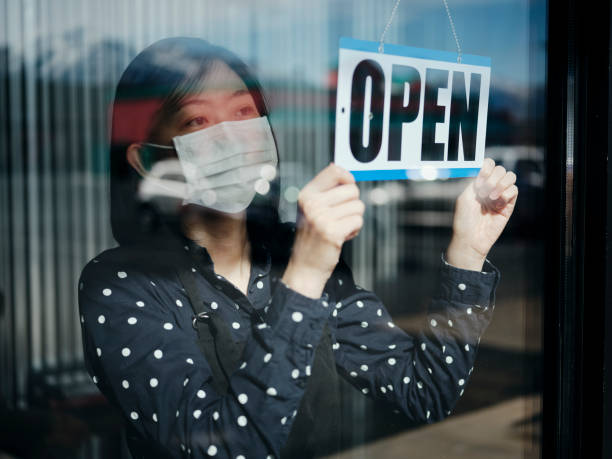 istock Business Owner Open Sign 1219409233