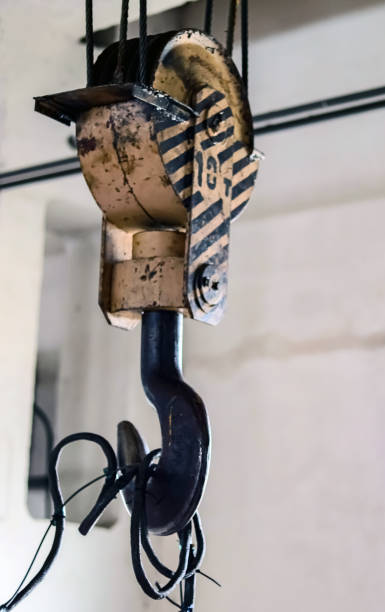 istock Industry. Metal hook with lifting cable mechanism. Close-up. 1219409294