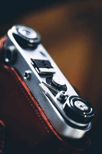 istock Vintage camera with a lens in a leather case 1219412938