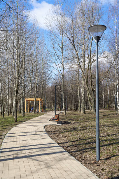 Pedestrian walkway and wooden pergola in the park in springtime in Yuzhnoye Medvedkovo district, Moscow