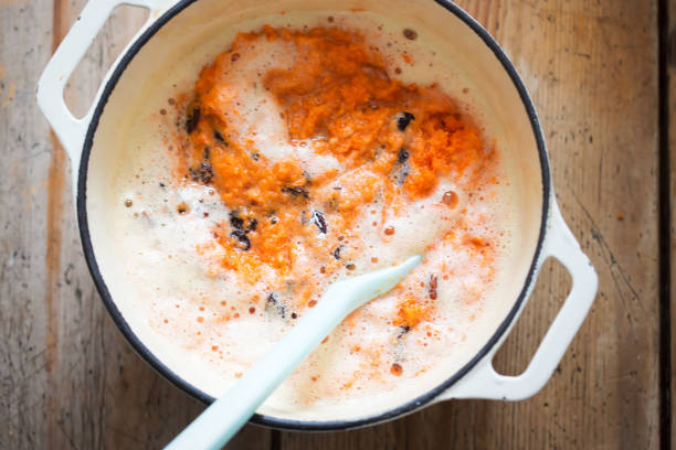 istock Carrot cake batter with beaten eggs, grated carrots & raisins 1219413739