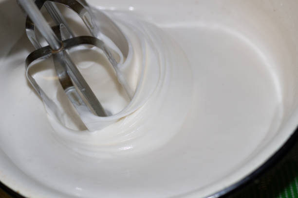 istock Blender mixing white cream in bowl close up 1219414606