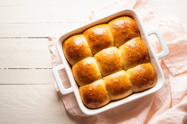 istock Bread buns in a ceramic tray. Sourdough bread buns 1219416134