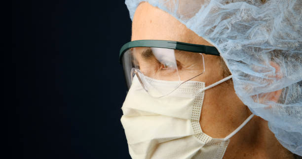 istock Serious, overworked, female health care worker 1219416453
