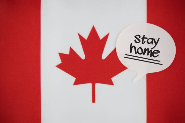 istock White Speech Bubble Note Paper With Stay Home Message On The Canadian Flag 1219419477