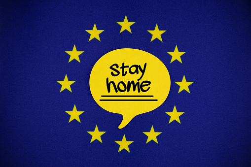 White Speech Bubble Note Paper With Stay Home Message On The European union Flag. Horizontal composition with copy space.
