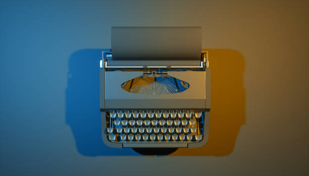 istock typewriter on a black background in blue and yellow lighting 1219419616