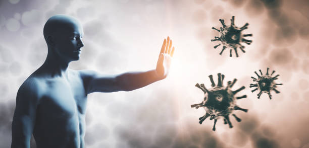 istock Man stopping coronavirus. Immune system defend from corona virus COVID-19. 1219421867