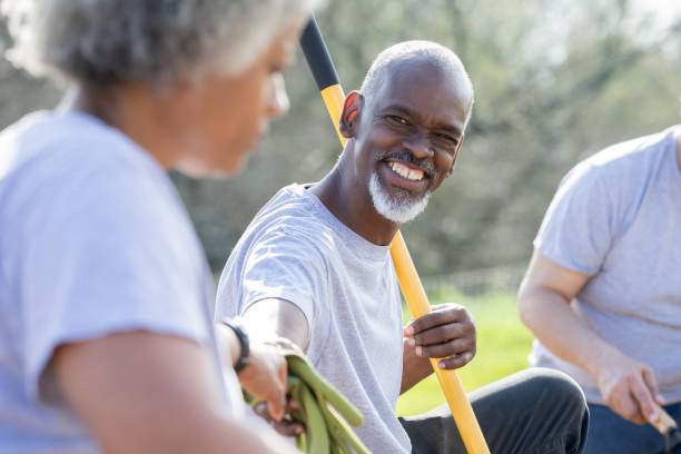 istock Senior volunteering in community garden 1219423272