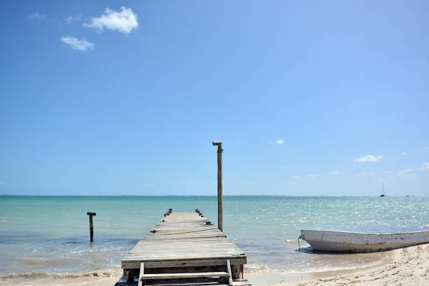 istock Wooden pier with blue sea and blue sky on background. 1219423736