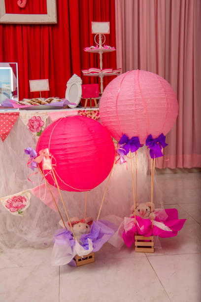 istock Paper decorations on the festive table in pink and white. 1219423749