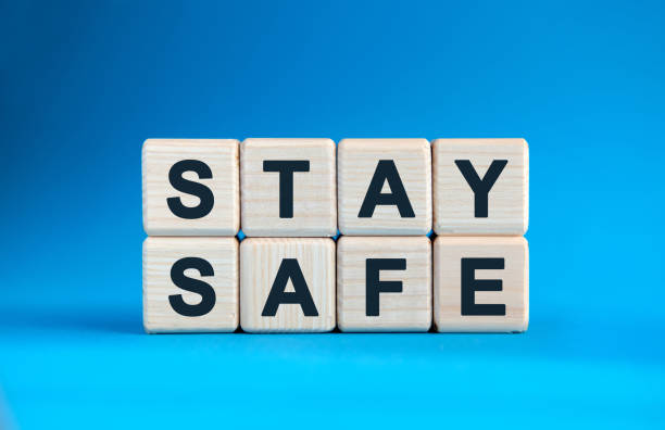 istock STAY SAFE - text on wooden cubes on a blue gradient background 1219426110