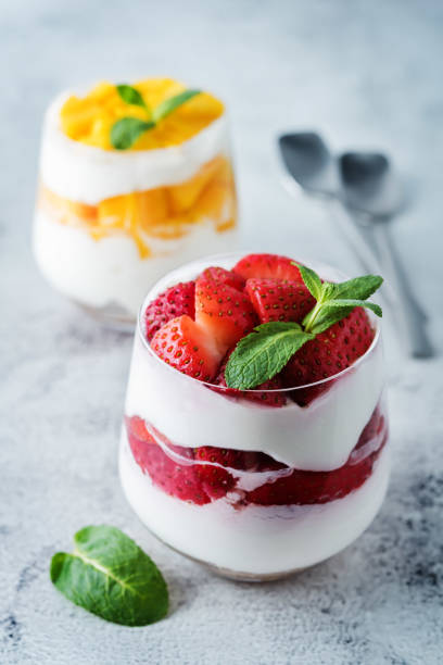 istock Greek yogurt strawberry and mango parfait in glasses 1219427316