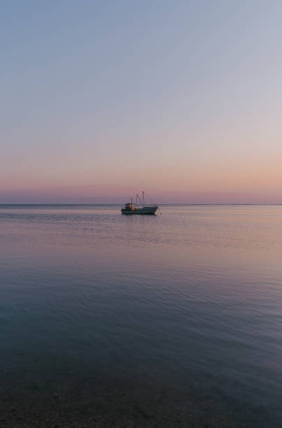 istock Boat  on Baltic sea at sunset 1219428317