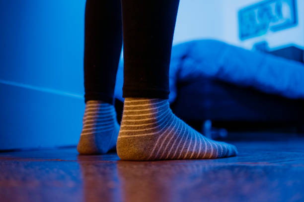 istock feet in room with socks 1219430987