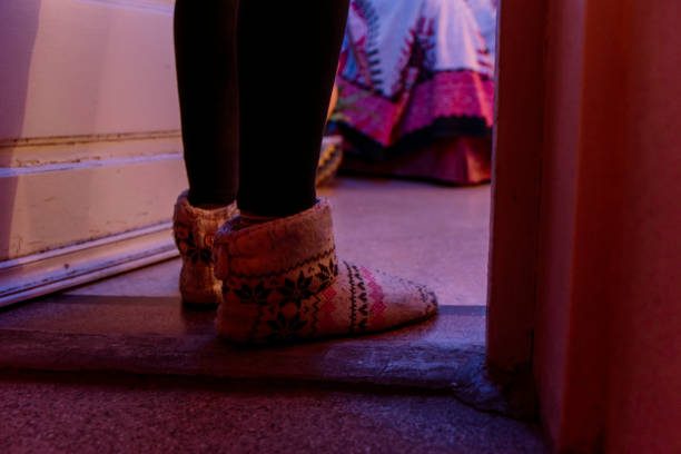 istock person in winter slippers 1219431120
