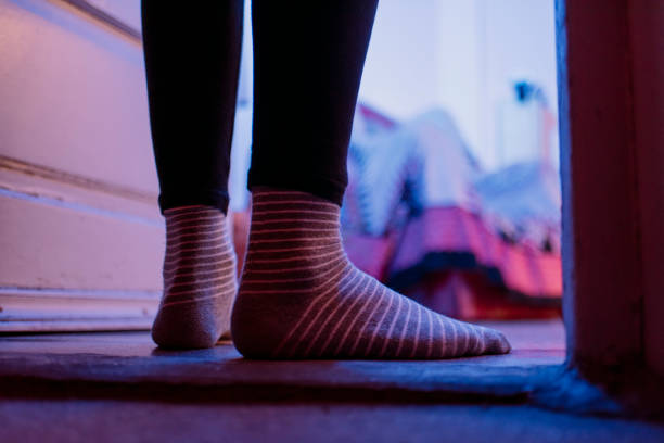 istock people feet in room with socks 1219431176