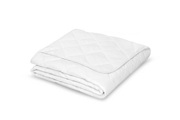 istock Folded soft white blanket, bedspread or duvet for a comfortable sleep. White blanket folded on a white background. Fabric structure. 3D blanket model. Comfortable sleep. Close up photo 1219431349