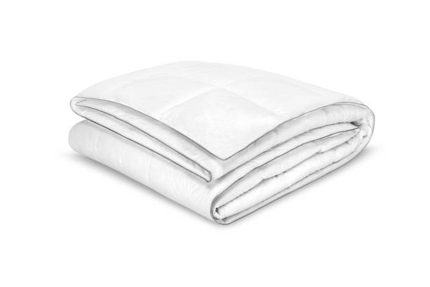 Folded soft white blanket, bedspread or duvet for a comfortable sleep. White blanket folded on a white background. Fabric structure. 3D blanket model. Comfortable sleep. Close up photo