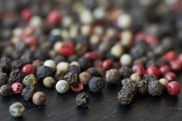 istock Pepper spice texture. Multicolored pepper corns, mix of colorful grains. Selective focus. 1219432485