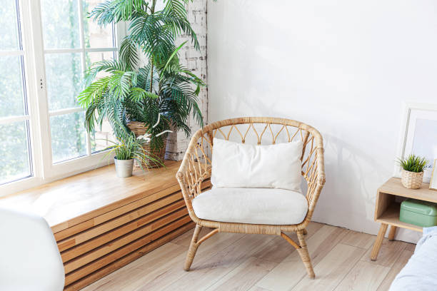 istock Stylish loft bedroom interior. Spacious design apartment with light walls large windows and armchair. Clean modern decoration with elegant furniture in minimalist Scandinavian style 1219432881
