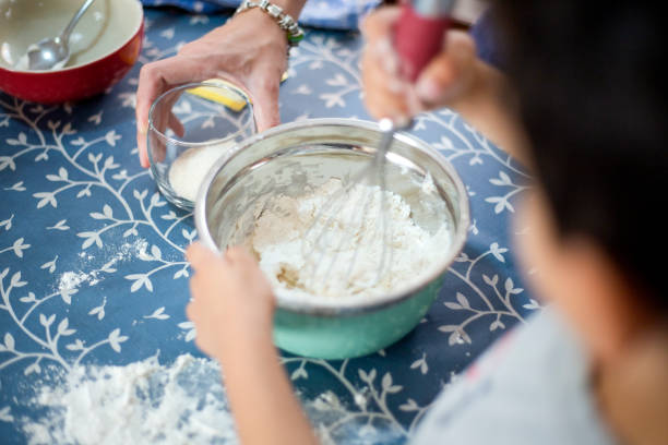 istock Child cooking at home with mom 1219432928