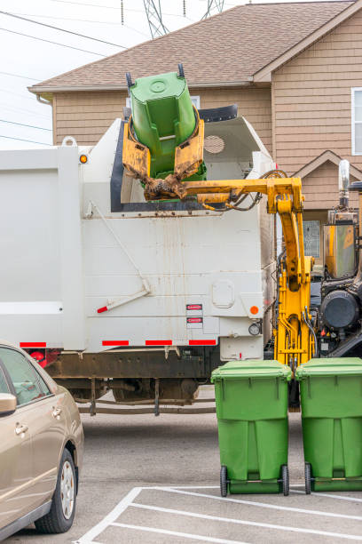 istock Garbage Truck Dumps Residential Trash Containers 1219433593