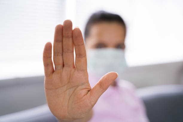 istock Woman Making Coronavirus Pandemic Stop Gesture 1219438051