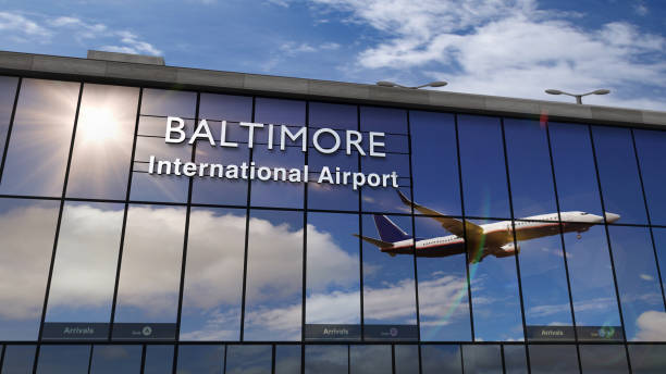 istock Airplane landing at Baltimore mirrored in terminal 1219439522