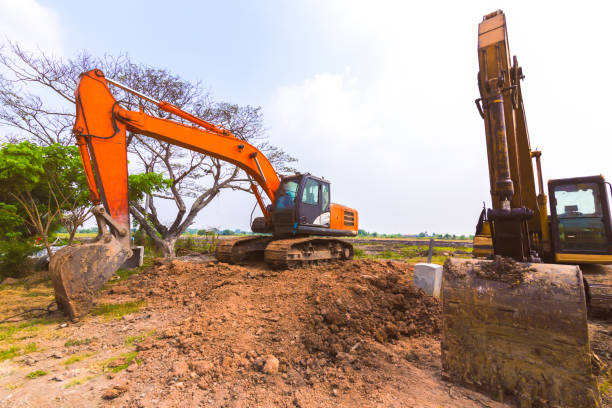 istock The orange backhoe is on the ground. 1219440723