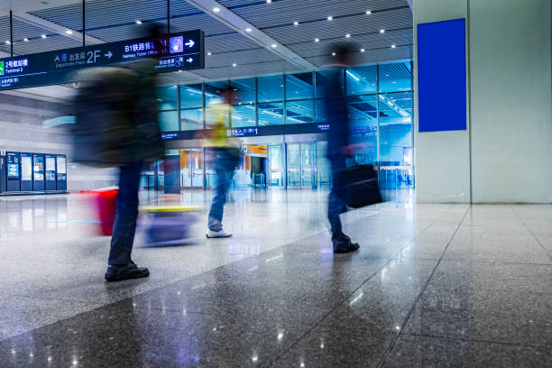 istock Airport passengers crowd walking blurred people 1219440753
