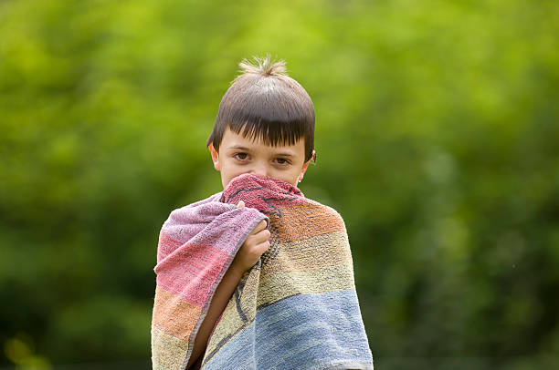 istock Wet boy dries himself with towel 121944370
