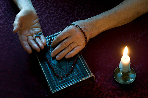istock Women's hands show old rosary 121944431