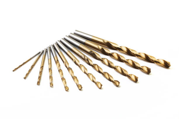 set of ten drill bits on white with selective focus - drill bit fotos imagens e fotografias de stock