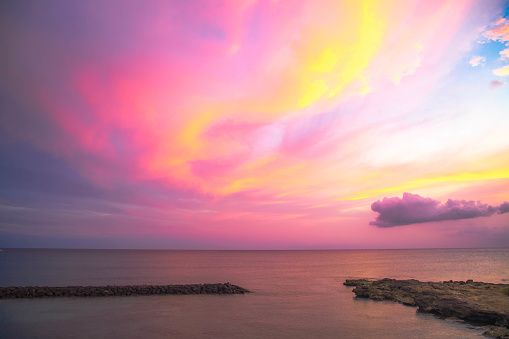 colorful cotton candy cloud sunset over the ocean in Hawaii